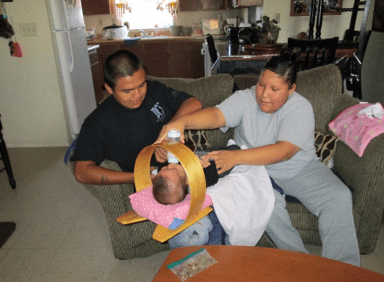 Parents feeding infant